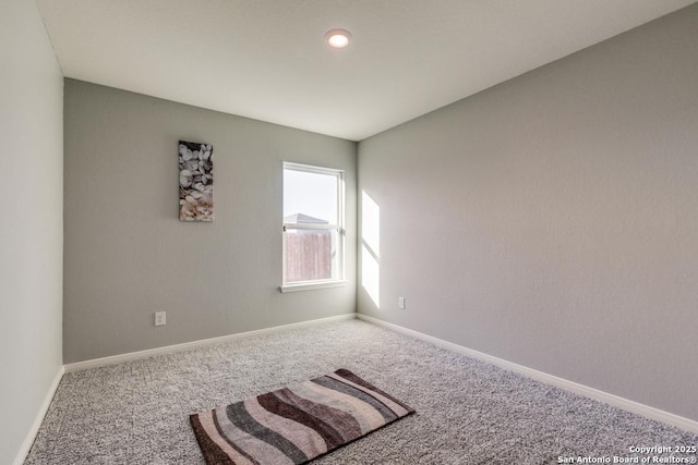 11715 Claudette St, San Antonio, TX 78252 - carpeted spare room featuring baseboards