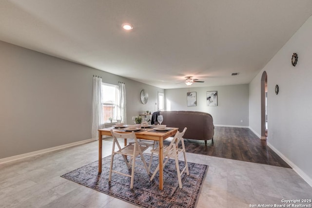 11715 Claudette St, San Antonio, TX 78252 - dining area featuring arched walkways, a ceiling fan, baseboards, wood finished floors, and recessed lighting