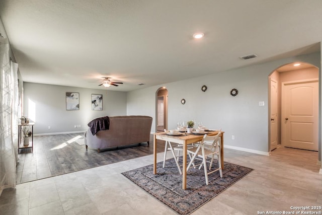 11715 Claudette St, San Antonio, TX 78252 - dining room featuring arched walkways, ceiling fan, baseboards, and recessed lighting