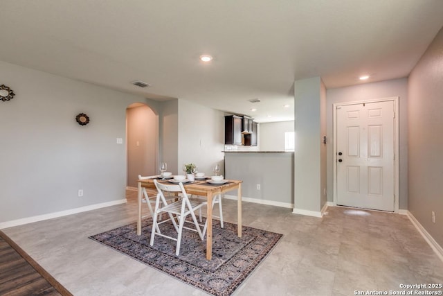 11715 Claudette St, San Antonio, TX 78252 - dining space with arched walkways, recessed lighting, and baseboards