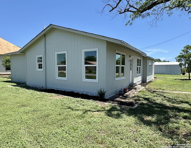 419 W Culberson, Sabinal, TX 78881 - view of side of property featuring a lawn