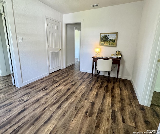 419 W Culberson, Sabinal, TX 78881 - bedroom featuring wood finished floors and baseboards