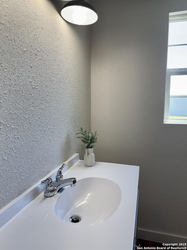 419 W Culberson, Sabinal, TX 78881 - bathroom with a sink and a textured wall