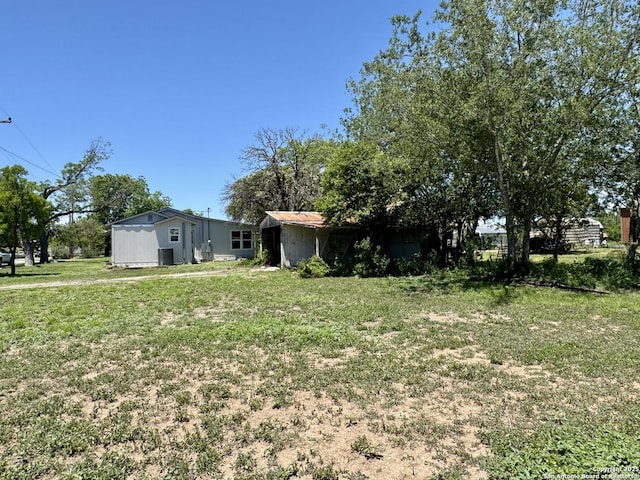 419 W Culberson, Sabinal, TX 78881 - view of green lawn featuring cooling unit