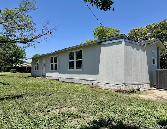 419 W Culberson, Sabinal, TX 78881 - view of side of property featuring cooling unit, a yard, and crawl space