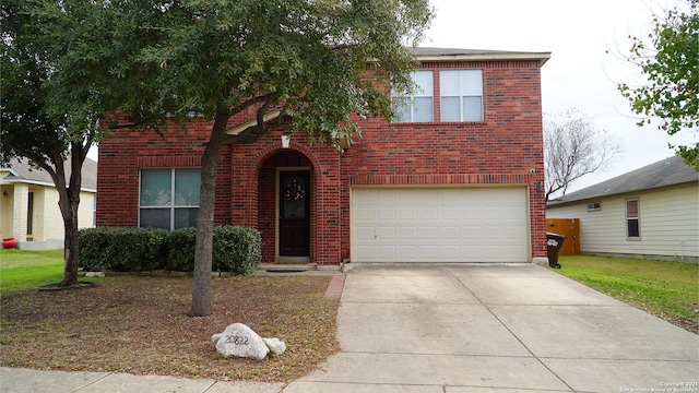 traditional-style home with brick siding, an attached garage, and concrete driveway