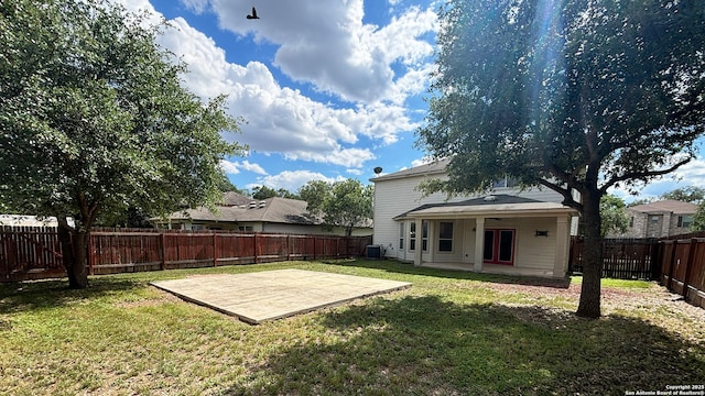 view of yard with a patio and central air condition unit