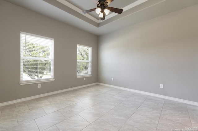 1407 Tanglewood, Spring Branch, TX 78070 - spare room featuring a tray ceiling, a ceiling fan, baseboards, and light tile patterned floors