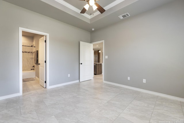 1407 Tanglewood, Spring Branch, TX 78070 - unfurnished bedroom with baseboards, a tray ceiling, and a ceiling fan