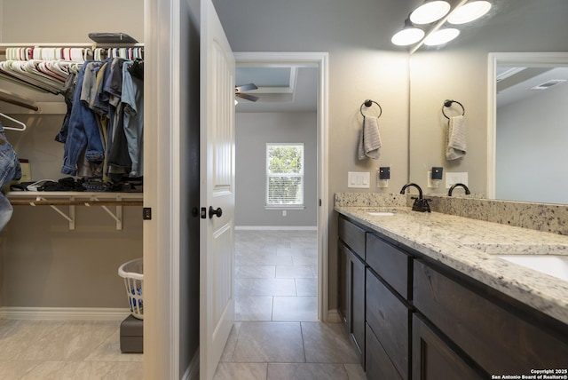 1407 Tanglewood, Spring Branch, TX 78070 - full bath with a spacious closet, tile patterned flooring, double vanity, and baseboards