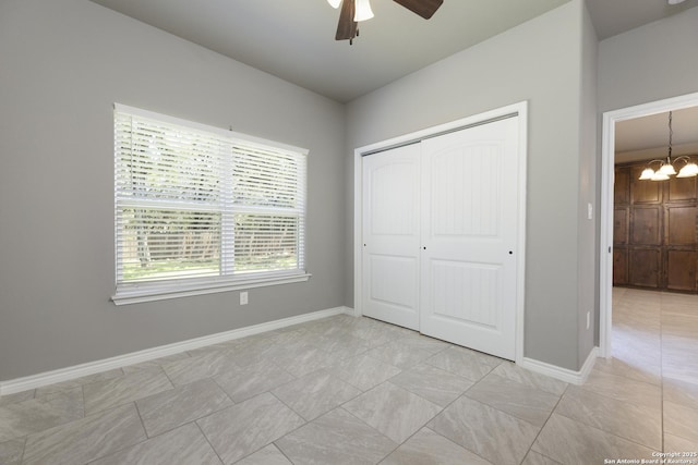 1407 Tanglewood, Spring Branch, TX 78070 - unfurnished bedroom featuring a chandelier, a closet, baseboards, and ceiling fan