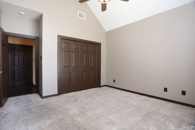 1181 County Road 4516, Castroville, TX 78009 - unfurnished bedroom featuring high vaulted ceiling, carpet flooring, a closet, baseboards, and ceiling fan