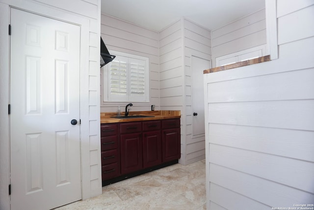 1181 County Road 4516, Castroville, TX 78009 - bathroom with vanity and wood walls