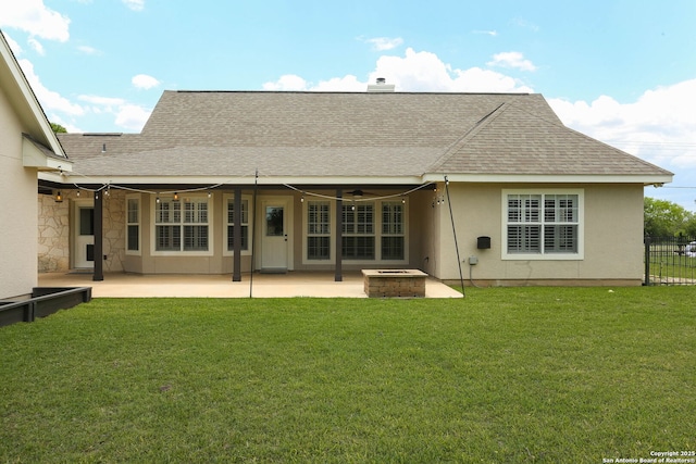 1181 County Road 4516, Castroville, TX 78009 - back of house with a fire pit, roof with shingles, a patio area, and stucco siding