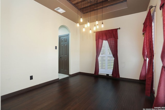 1181 County Road 4516, Castroville, TX 78009 - spare room with arched walkways, wood finished floors, baseboards, and a towering ceiling