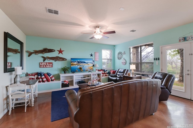 315 E Klein, New Braunfels, TX 78130 - living room featuring tile patterned flooring, a ceiling fan, and baseboards