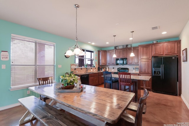 315 E Klein, New Braunfels, TX 78130 - dining space with baseboards, recessed lighting, and a chandelier