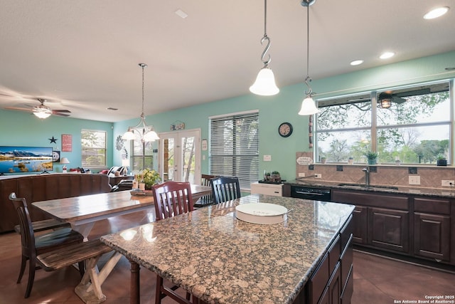 315 E Klein, New Braunfels, TX 78130 - kitchen with a sink, plenty of natural light, dark brown cabinetry, tasteful backsplash, and recessed lighting