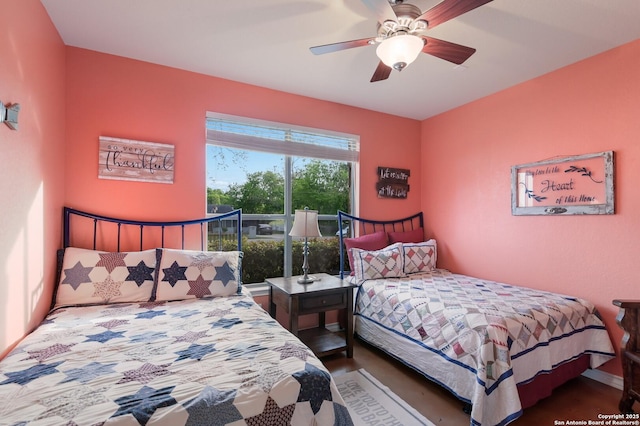 315 E Klein, New Braunfels, TX 78130 - bedroom with ceiling fan and wood finished floors