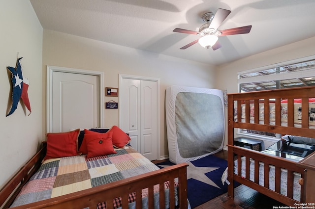 315 E Klein, New Braunfels, TX 78130 - bedroom with wood finished floors and ceiling fan
