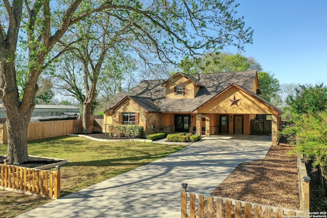 315 E Klein, New Braunfels, TX 78130 - view of front of house featuring concrete driveway, stone siding, and a carport