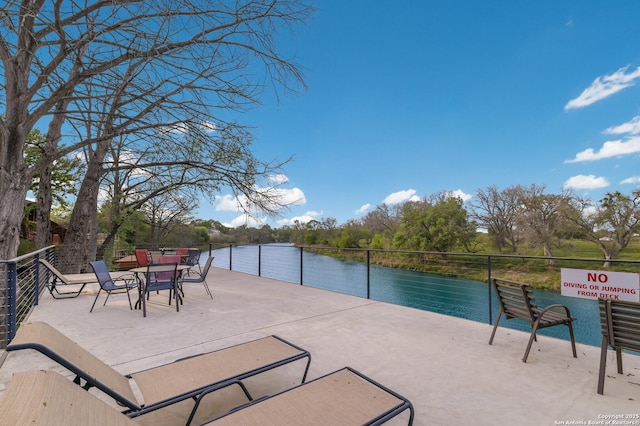 315 E Klein, New Braunfels, TX 78130 - view of patio with a water view and outdoor dining space