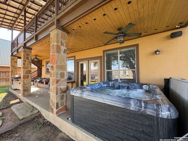 315 E Klein, New Braunfels, TX 78130 - view of patio featuring a hot tub, a ceiling fan, and a balcony