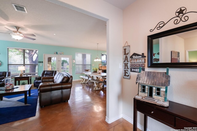 315 E Klein, New Braunfels, TX 78130 - tiled living room with french doors, baseboards, and a ceiling fan