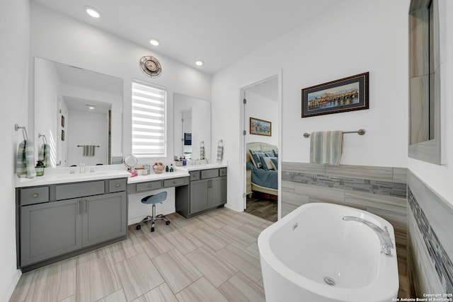 11109 Molly Run, San Antonio, TX 78254 - ensuite bathroom with a freestanding bath, vanity, and recessed lighting