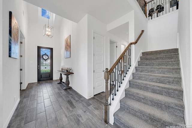 11109 Molly Run, San Antonio, TX 78254 - entrance foyer featuring stairs, a chandelier, a high ceiling, baseboards, and dark wood finished floors