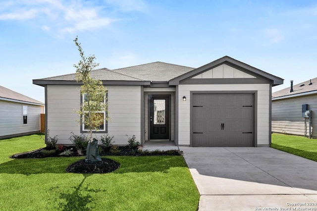 ranch-style home with a front yard, a garage, and concrete driveway
