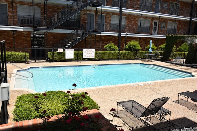 8401 New Braunfels Unit 125, San Antonio, TX 78209 - community pool featuring stairs and fence