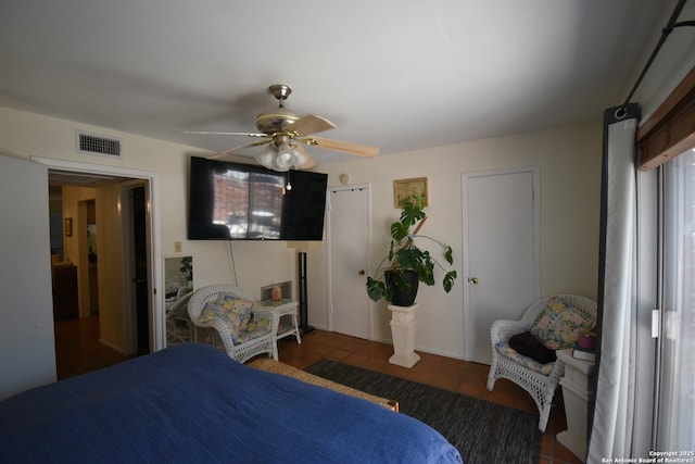 8401 New Braunfels Unit 125, San Antonio, TX 78209 - tiled bedroom featuring a ceiling fan