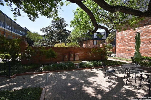 8401 New Braunfels Unit 125, San Antonio, TX 78209 - view of patio / terrace featuring fence and outdoor dining space