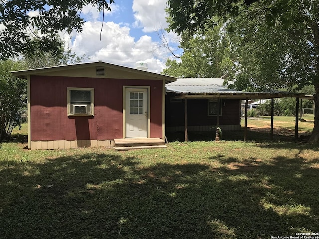 118 S Garcia St, Pearsall, TX 78061 - rear view of house featuring a lawn