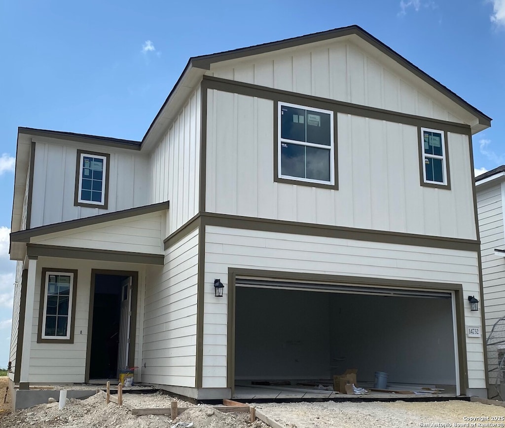 14732 Prairie Clover, San Antonio, TX 78253 - view of front of home featuring an attached garage and board and batten siding