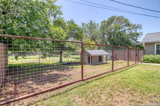 296 Cherokee Dr, Bandera, TX 78003 - view of yard featuring an outdoor structure and exterior structure