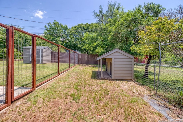 296 Cherokee Dr, Bandera, TX 78003 - view of yard featuring a storage unit and an outdoor structure