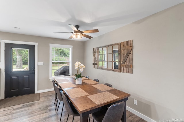 296 Cherokee Dr, Bandera, TX 78003 - dining space featuring baseboards, wood finished floors, and a ceiling fan