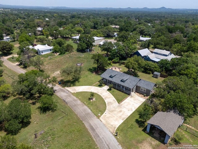 296 Cherokee Dr, Bandera, TX 78003 - view of property location featuring a heavily wooded area