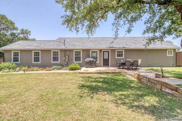 296 Cherokee Dr, Bandera, TX 78003 - back of house with a patio area and a lawn