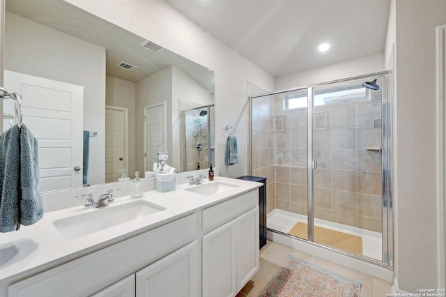 10227 Azealia Way, Boerne, TX 78006 - full bathroom with a stall shower, double vanity, and tile patterned floors