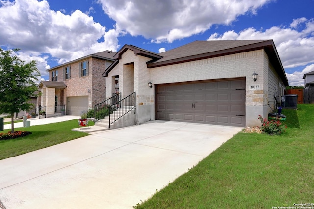 10227 Azealia Way, Boerne, TX 78006 - view of front of house featuring driveway, brick siding, a garage, and a front yard