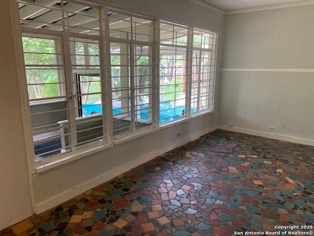 434 Hermine, San Antonio, TX 78212 - spare room featuring baseboards, healthy amount of natural light, and crown molding