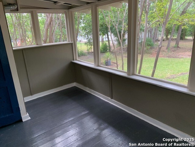 434 Hermine, San Antonio, TX 78212 - unfurnished sunroom featuring baseboards and hardwood / wood-style flooring