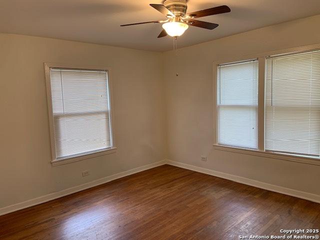 434 Hermine, San Antonio, TX 78212 - unfurnished room featuring dark wood-style flooring, baseboards, and ceiling fan