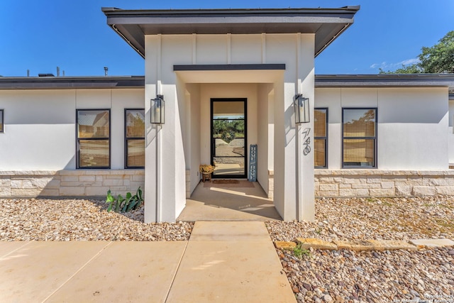 740 Sharp Spgs, Bulverde, TX 78163 - view of exterior entry featuring board and batten siding and stone siding