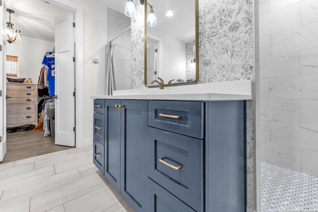740 Sharp Spgs, Bulverde, TX 78163 - full bathroom featuring a tile shower, wood finish floors, and vanity