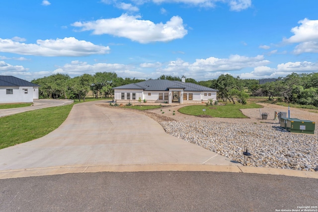 740 Sharp Spgs, Bulverde, TX 78163 - view of front of house featuring curved driveway, a front yard, and metal roof