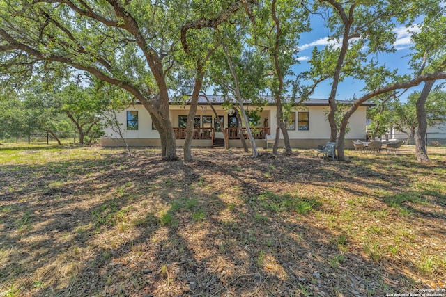 740 Sharp Spgs, Bulverde, TX 78163 - back of property with stucco siding, fence, and a deck